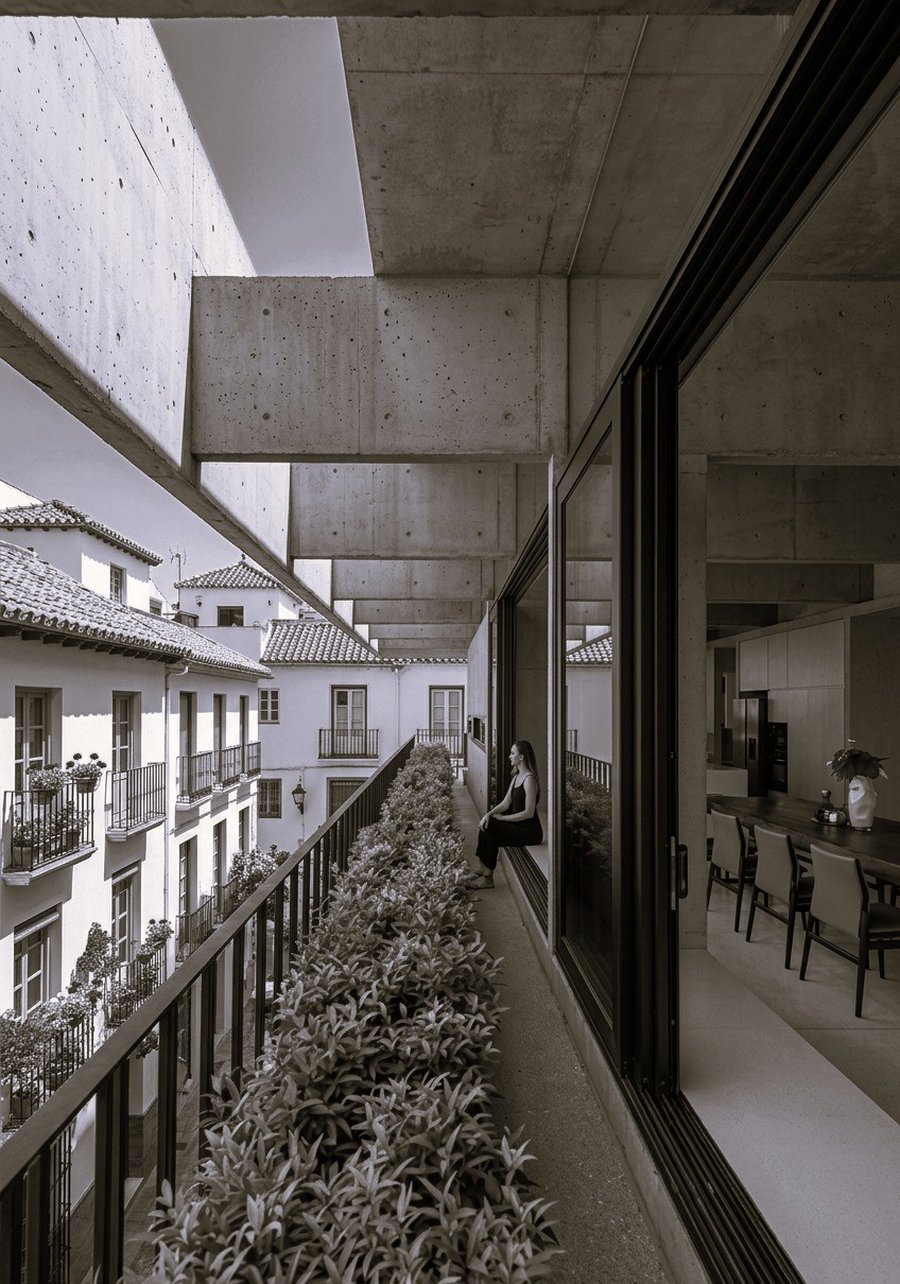 Curved concrete interior with skylight and canal view